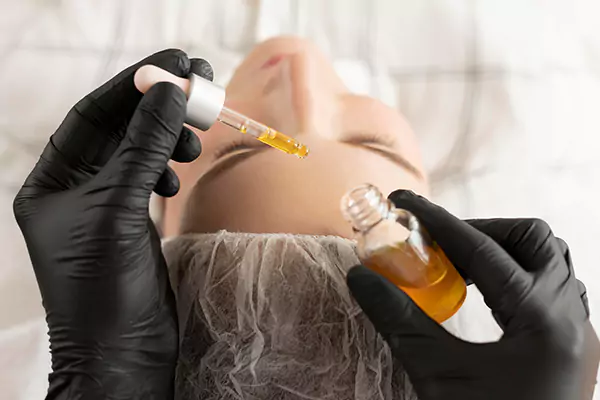 young-woman-getting-eyebrow-treatment-beauty-salon-6593df098625f